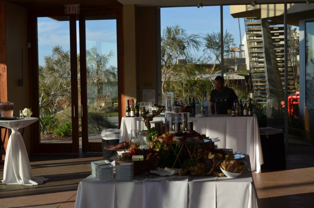 Cocktail Hour set up with the beautiful courtyard as the backdrop at Scripps Seaside Forum