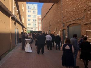 Guests enjoying cocktails in the alley at the Horton Grand