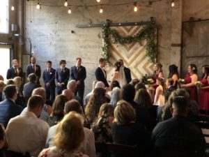 Ceremony in front of the barn door at Luce Loft